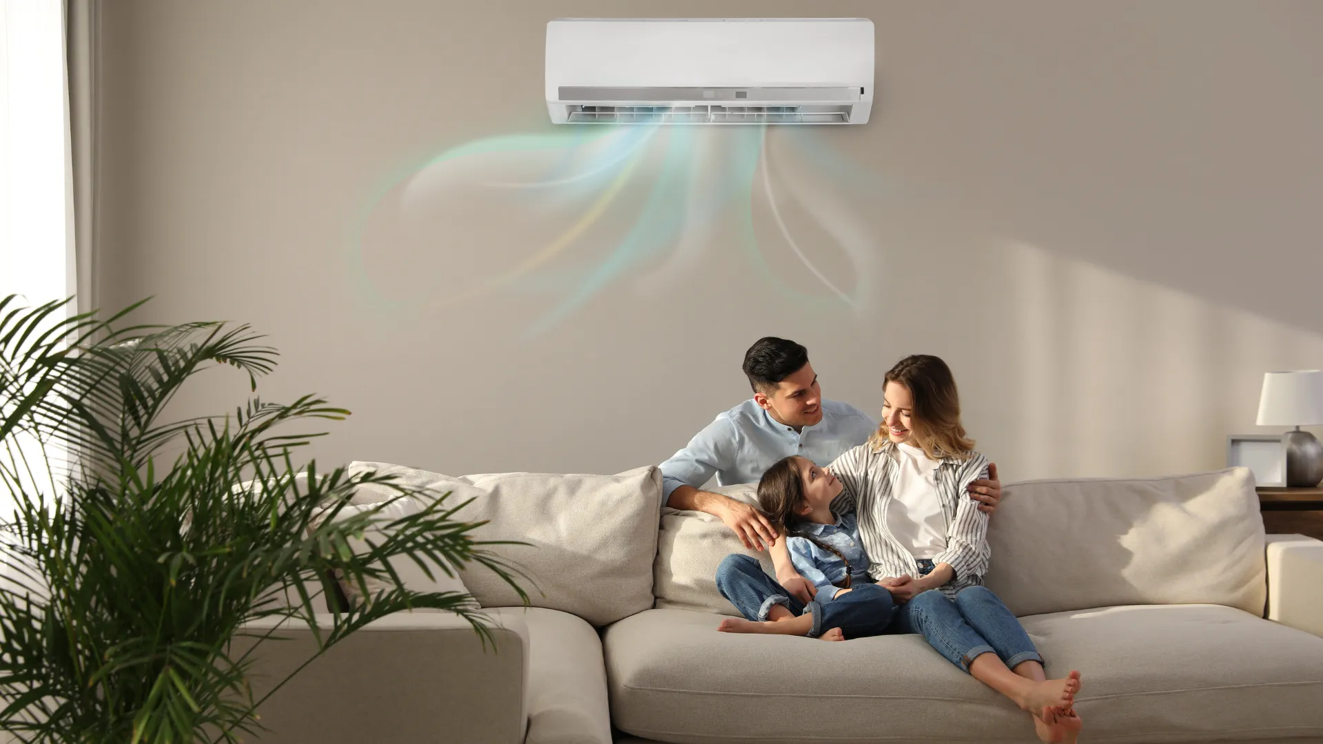 famille dans le canapé sous leurs climatisation pac air air